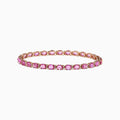 The 14K Rose Gold Pink Sapphire and Diamond Tennis Bracelet (9.03 TCW) features a single row of round pink sapphires in prong settings, displayed against a white background.