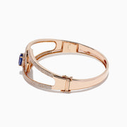 The Nahla Siri 14K Rose Gold Tanzanite and Diamond Bangle, 3.76 TCW, features a central oval tanzanite encircled by white diamonds and additional diamonds along its elegant openwork band.