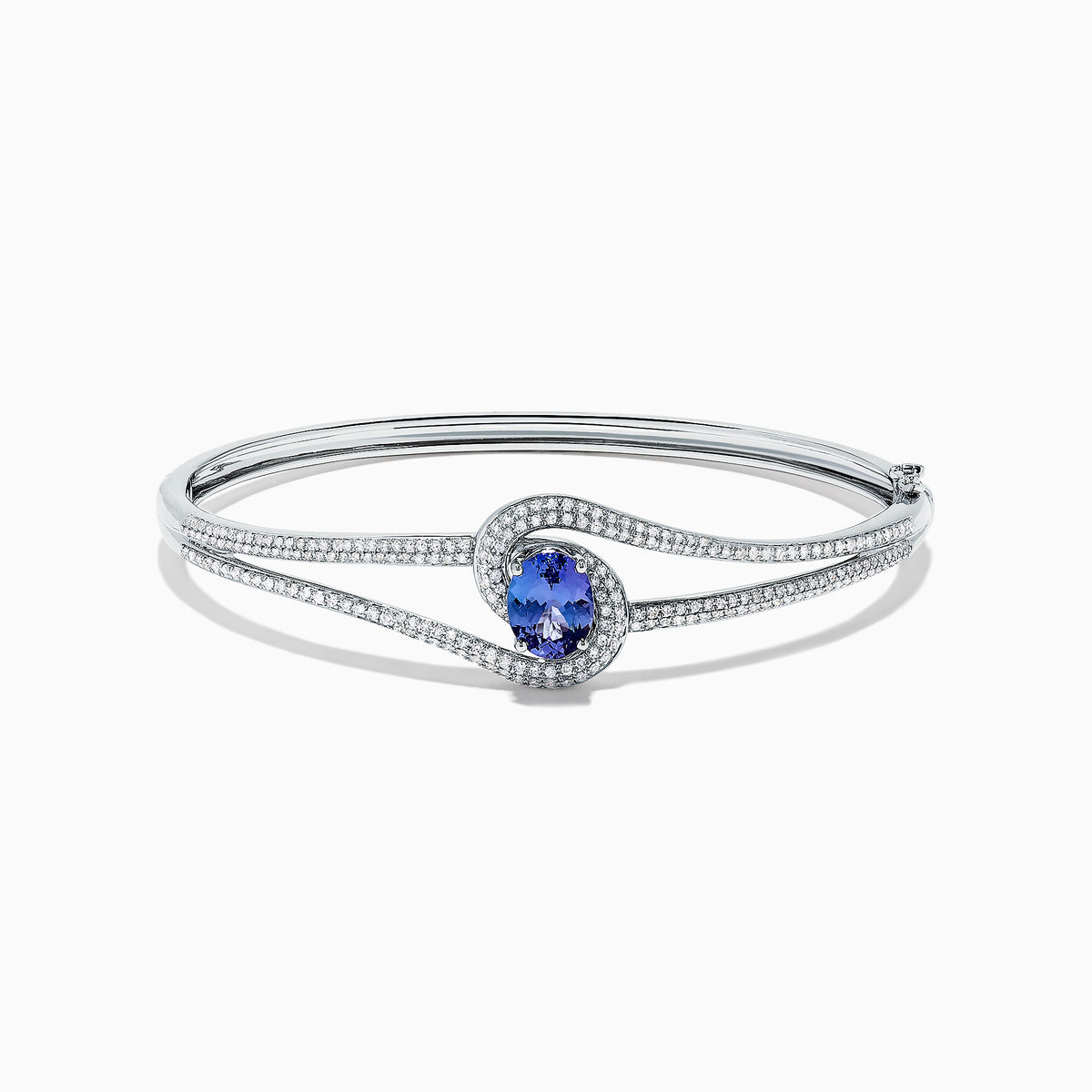 The Nahla Siri 14K White Gold Tanzanite and Diamond Bangle, 2.61 TCW, showcases a central round tanzanite gemstone encircled by sparkling diamonds on a sleek, open band design.