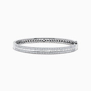 The Classique 14K White Gold Diamond Bangle 2.41 TCW features two rows of sparkling diamonds along the front and an intricate cutout interior, blending elegance and craftsmanship from the Effy Classique collection.