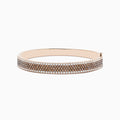 The 14K Rose Gold Espresso and White Diamond Bangle features rows of sparkling espresso brown and white diamonds, beautifully showcased against a plain white background.