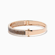 The 14K Rose Gold Espresso and White Diamond Bangle features rows of sparkling espresso brown and white diamonds, beautifully showcased against a plain white background.