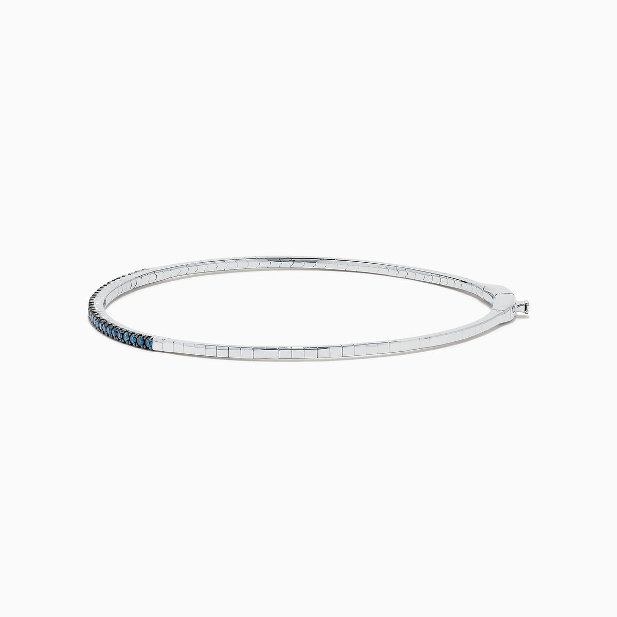 The Bella Bleu 14K White Gold Blue Diamond Bangle showcases a slim white gold design accented with brilliant blue diamonds, offering an elegant sparkle to any ensemble.