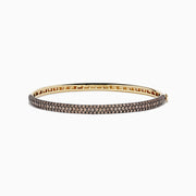 The 14K Yellow Gold Espresso Diamond Pave Bangle, 3.12 TCW, features two rows of sparkling espresso diamonds set along the outer surface for a sleek and elegant look.