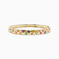 The Watercolors 14K Yellow Gold Multi Sapphire Bangle features sapphires in pink, green, blue, and yellow shades arranged in a scattered design around the band.