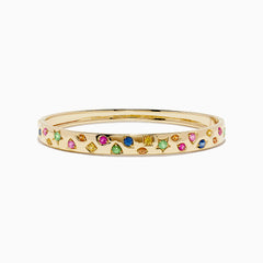 The Watercolors 14K Yellow Gold Multi Sapphire Bangle features sapphires in pink, green, blue, and yellow shades arranged in a scattered design around the band.