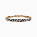 The Signature 14K Yellow Gold Diamond Panther Spot Bangle showcases a leopard print with black, brown, and white stones and an elegant openwork interior design.