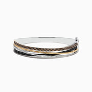 The 14K Trio-Color Gold Bangle features intertwined strands with brown, black, and white diamonds totaling 1.97 TCW, crafted in a polished finish for a sleek look.