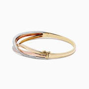 The Trio 14K Three-Tone Gold Diamond Bangle 0.29 TCW features intertwined bands of yellow, rose, and white gold with a row of sparkling diamonds on one band, shown against a white background.