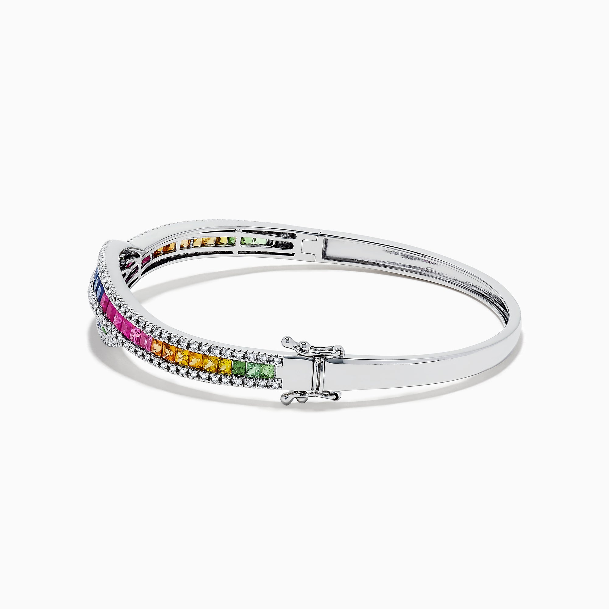 The 14K White Gold Multi Sapphire and Diamond Bangle showcases wavy rows of pink, blue, green, orange, and clear gemstones in an intricate and sparkling pattern for a vibrant look.