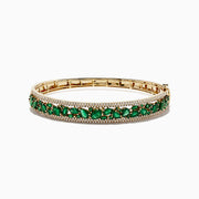 The Brasilica 14K Yellow Gold Emerald and Diamond Bangle, 6.81 TCW, features a secure clasp, elegant design, and is adorned with an intricate row of emeralds and small diamonds.