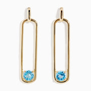 14K Yellow Gold Paperclip Blue Topaz Drop Earrings feature a minimalist, elongated design, each adorned with a round blue topaz at the bottom for effortless elegance.