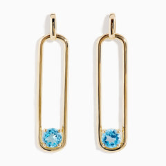 14K Yellow Gold Paperclip Blue Topaz Drop Earrings feature a minimalist, elongated design, each adorned with a round blue topaz at the bottom for effortless elegance.