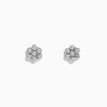 A pair of 14k White Gold Diamond bouquet studs, 0.52 TCW, features multiple round diamonds clustered in a floral design and set closely together in lustrous white gold.