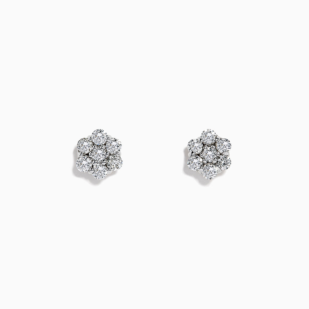 A pair of 14k White Gold Diamond bouquet studs, 0.52 TCW, features multiple round diamonds clustered in a floral design and set closely together in lustrous white gold.