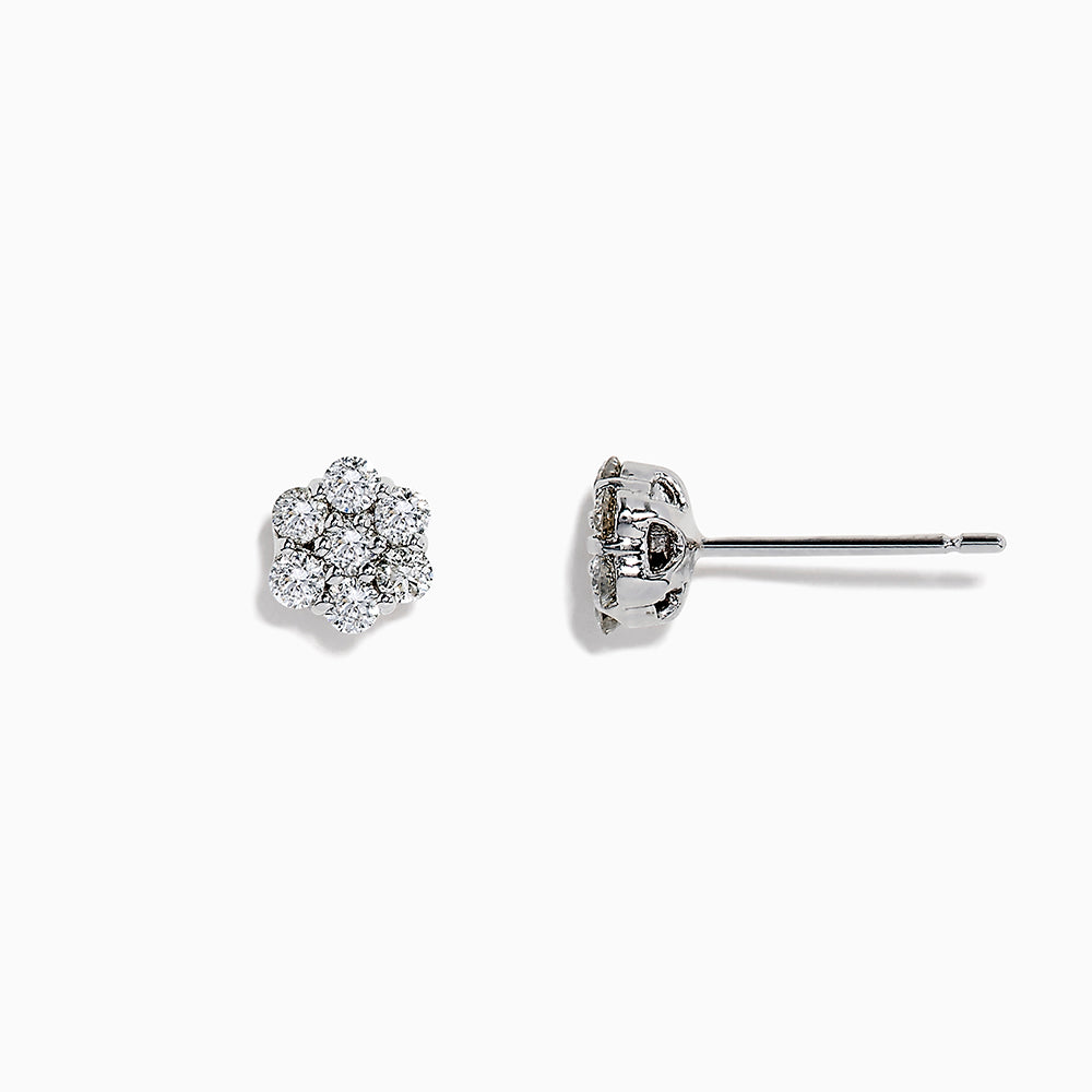 A pair of 14k White Gold Diamond bouquet studs, 0.52 TCW, features multiple round diamonds clustered in a floral design and set closely together in lustrous white gold.