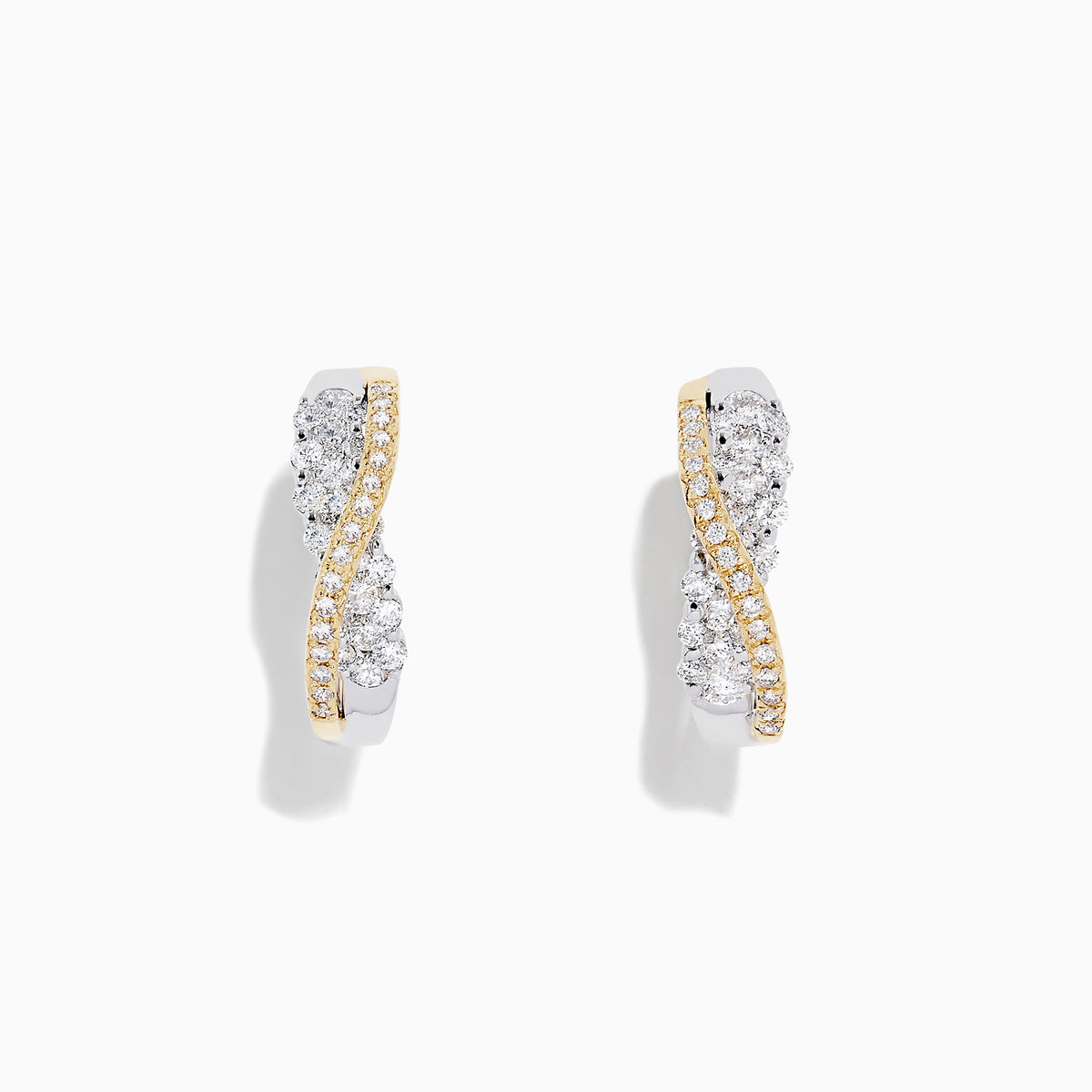 A pair of 14K White and Yellow Gold 3/4 Diamond Crossover Hoop Earrings (1.00 TCW) featuring a curved design with silver and gold tones, sparkling with encrusted diamonds against a plain white background.
