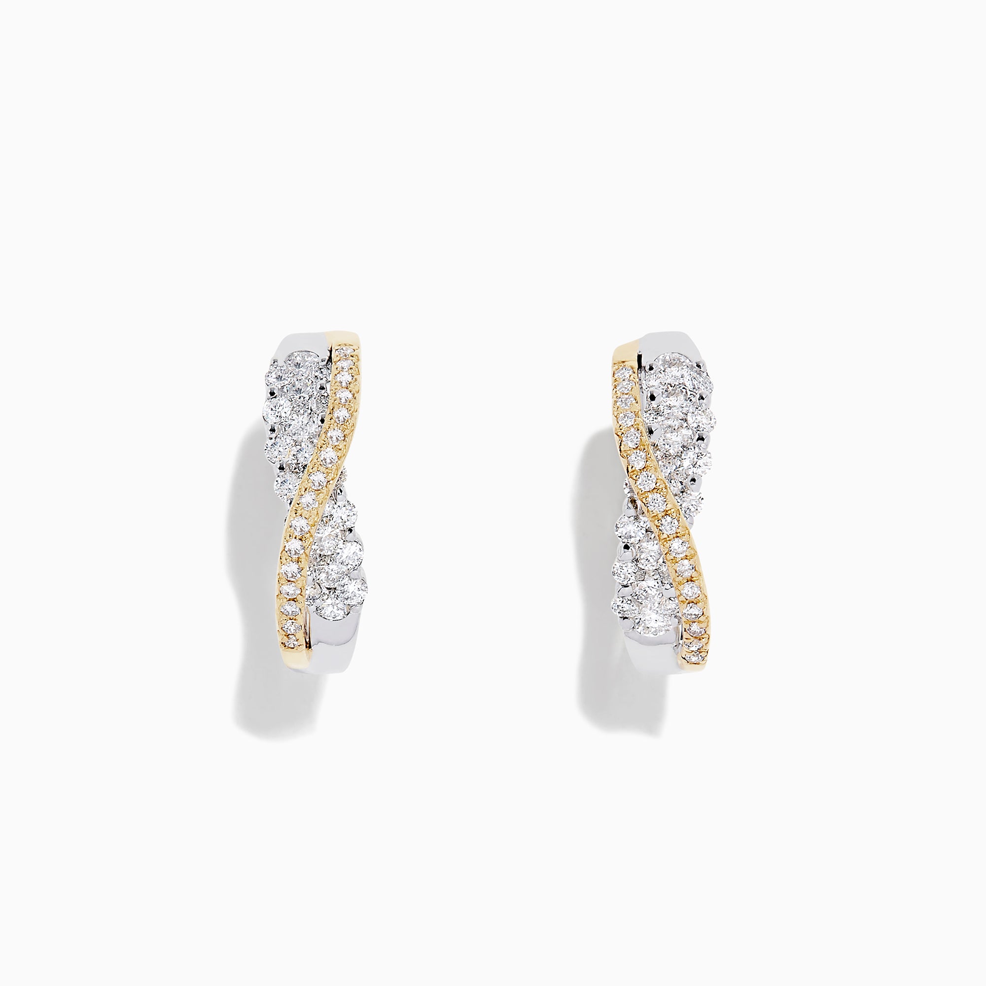 A pair of 14K White and Yellow Gold 3/4 Diamond Crossover Hoop Earrings (1.00 TCW) featuring a curved design with silver and gold tones, sparkling with encrusted diamonds against a plain white background.