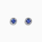 The Nahla Siri 14K White Gold Tanzanite and Diamond Stud Earrings, 1.04 TCW, feature vivid blue tanzanites encircled by sparkling diamonds in a polished white gold setting.