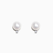 14K White Gold Cultured Freshwater Pearl & Diamond Earrings (0.05 TCW) feature round white pearls accented by small diamonds below each pearl, shown against a plain white background.