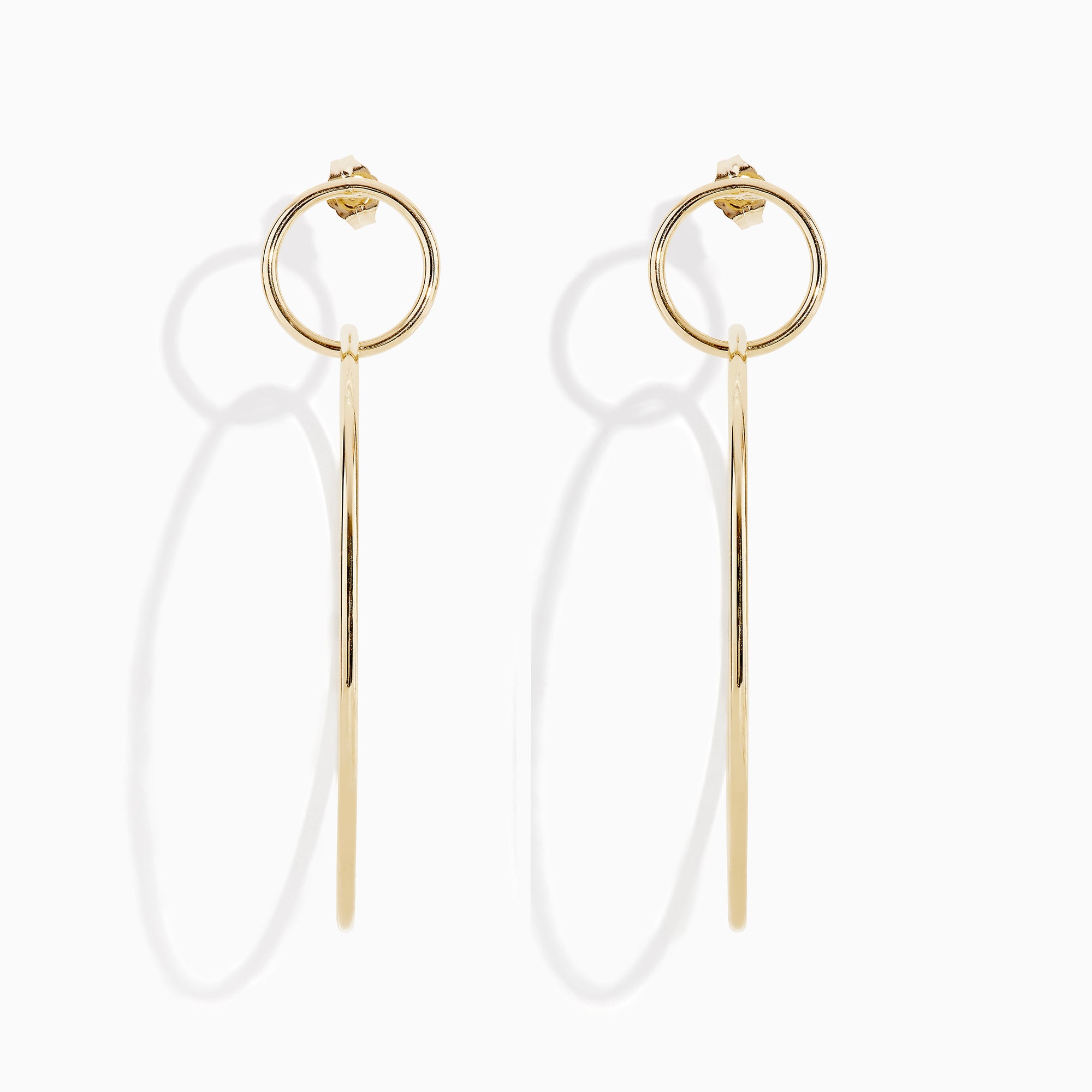 A pair of 14K Yellow Gold Double Circle Drop Earrings, one shown from the side and the other from the front, both displaying minimalist circular designs against a white background.