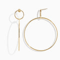 A pair of 14K Yellow Gold Double Circle Drop Earrings, one shown from the side and the other from the front, both displaying minimalist circular designs against a white background.
