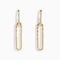 The 14K Yellow Gold Hoop and Paperclip Earrings feature elongated link shapes with twisted upper sections, shown against a white background.
