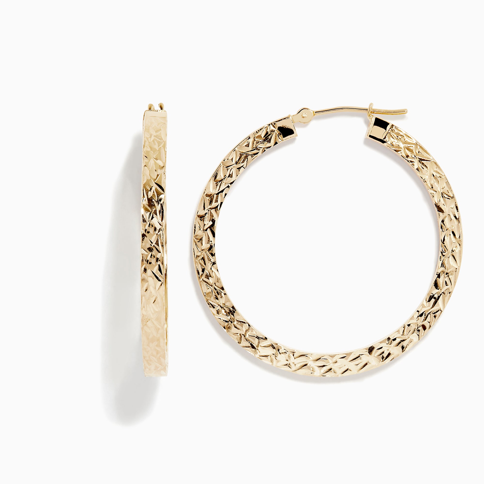 The 14K Yellow Gold Tube Hoop Earrings feature a diamond-patterned, textured surface, latch closures, and are shown with one earring from the front and one from the side.