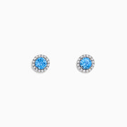 Ocean Bleu 14K White Gold Blue Topaz and Diamond Earrings, 1.32 TCW, feature round blue topaz center stones encircled by sparkling diamonds in a circular white gold setting on a white background.