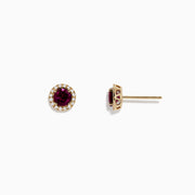 Bordeaux 14K Gold Rhodolite Garnet and Diamond Earrings, 1.22 TCW, feature round garnets encircled by sparkling diamonds in a 14K gold setting, displayed against a plain white background.