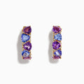 A pair of 14K yellow gold hoop earrings featuring alternating amethyst, tanzanite, and sparkling diamonds, displayed vertically on a white background.