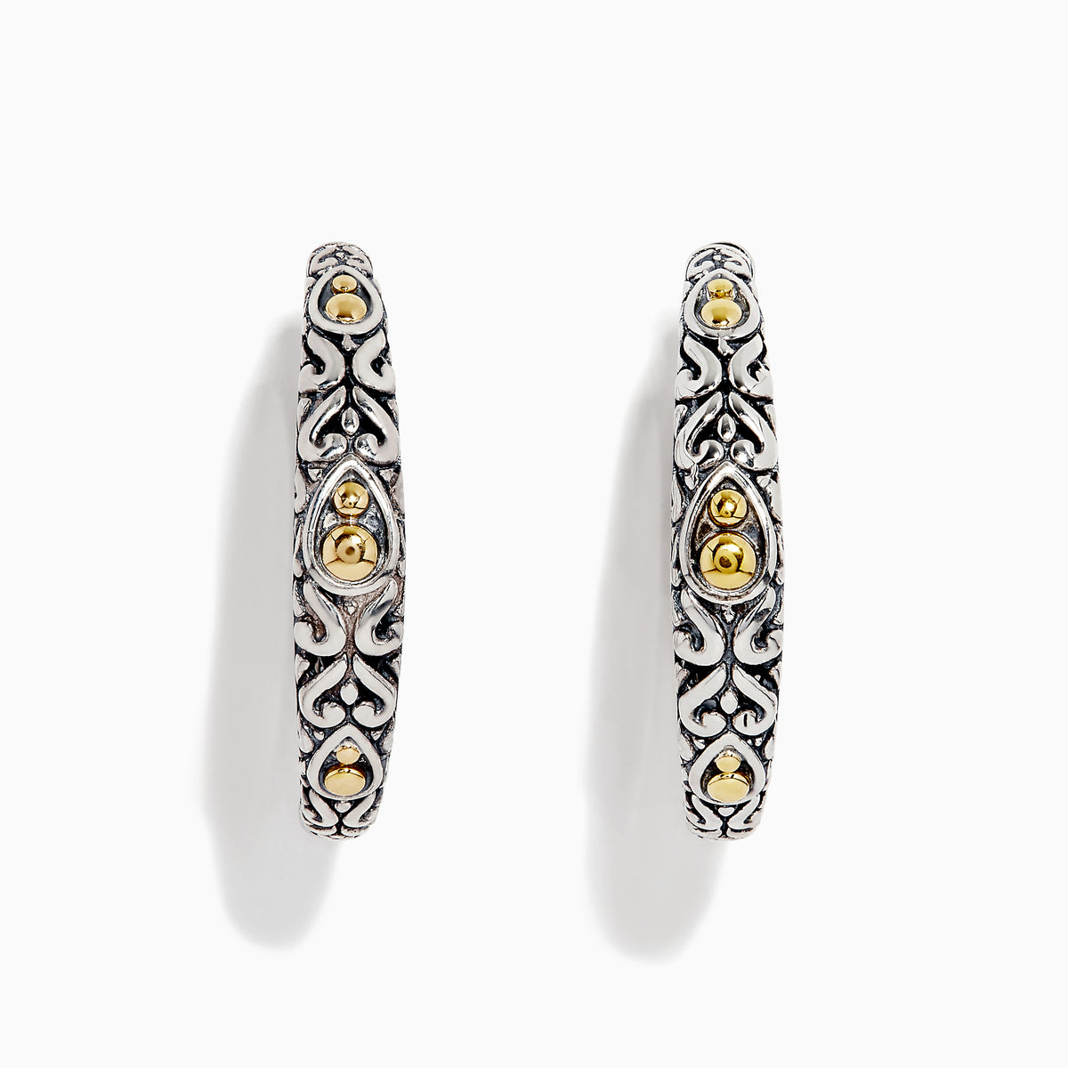 The 925 Sterling Silver & 18K Gold 1 Hoop Earrings feature intricate sterling silver patterns and subtle 18K gold accents, showcased against a white background.