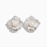 The 925 Sterling Silver Cultured Fresh Water Pearl Flower Earrings feature textured silver petals and a round freshwater pearl at each center, shown on a white background.