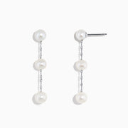 A pair of 14K White Gold Cultured Fresh Water Pearl Drop Earrings, each with three round pearls linked by slender silver chains, shown on a plain white background.