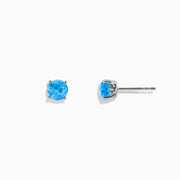 The Ocean Bleu 14K White Gold Blue Topaz Stud Earrings, 2.30 TCW, feature round faceted stones in prong settings and are displayed on a plain white background.