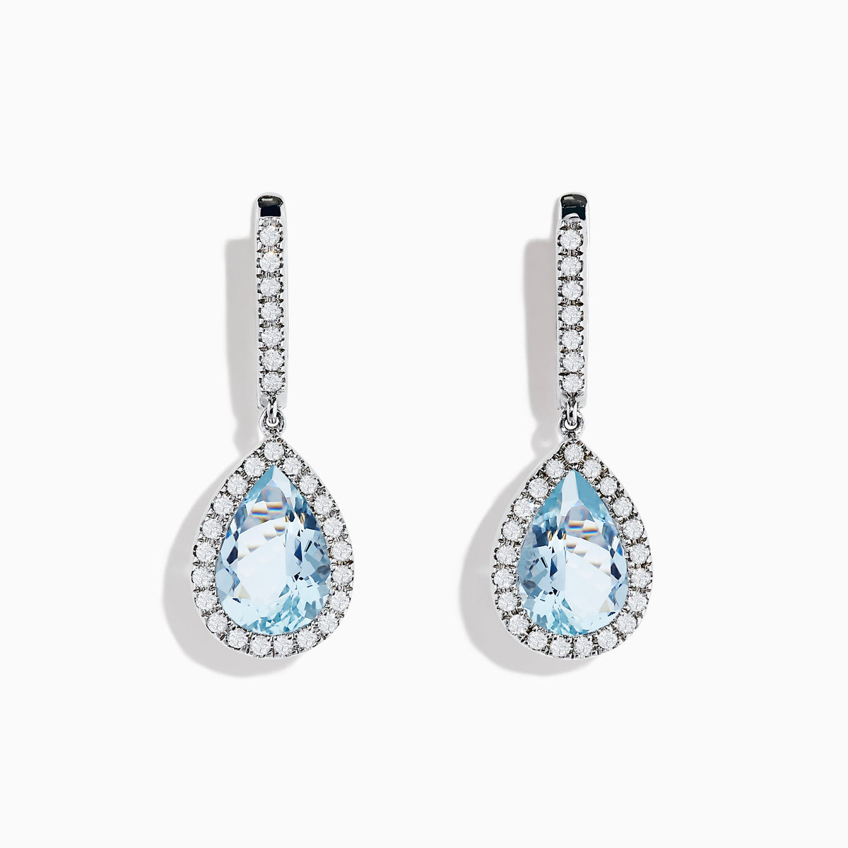 The Aquarius 14K White Gold Aquamarine and Diamond Drop Earrings feature pear-shaped Aquamarine gemstones with diamond halos and a row of diamonds on the hooks.