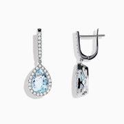 The Aquarius 14K White Gold Aquamarine and Diamond Drop Earrings feature pear-shaped Aquamarine gemstones with diamond halos and a row of diamonds on the hooks.
