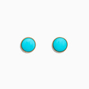 A pair of 14K Yellow Gold Turquoise Stud Earrings, 1.10 TCW, featuring round turquoise stones set in yellow gold, displayed on a white background.