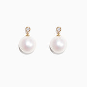 A pair of 14K yellow gold earrings with cultured freshwater pearls and sparkling diamonds (0.05 TCW), displayed on a white background.