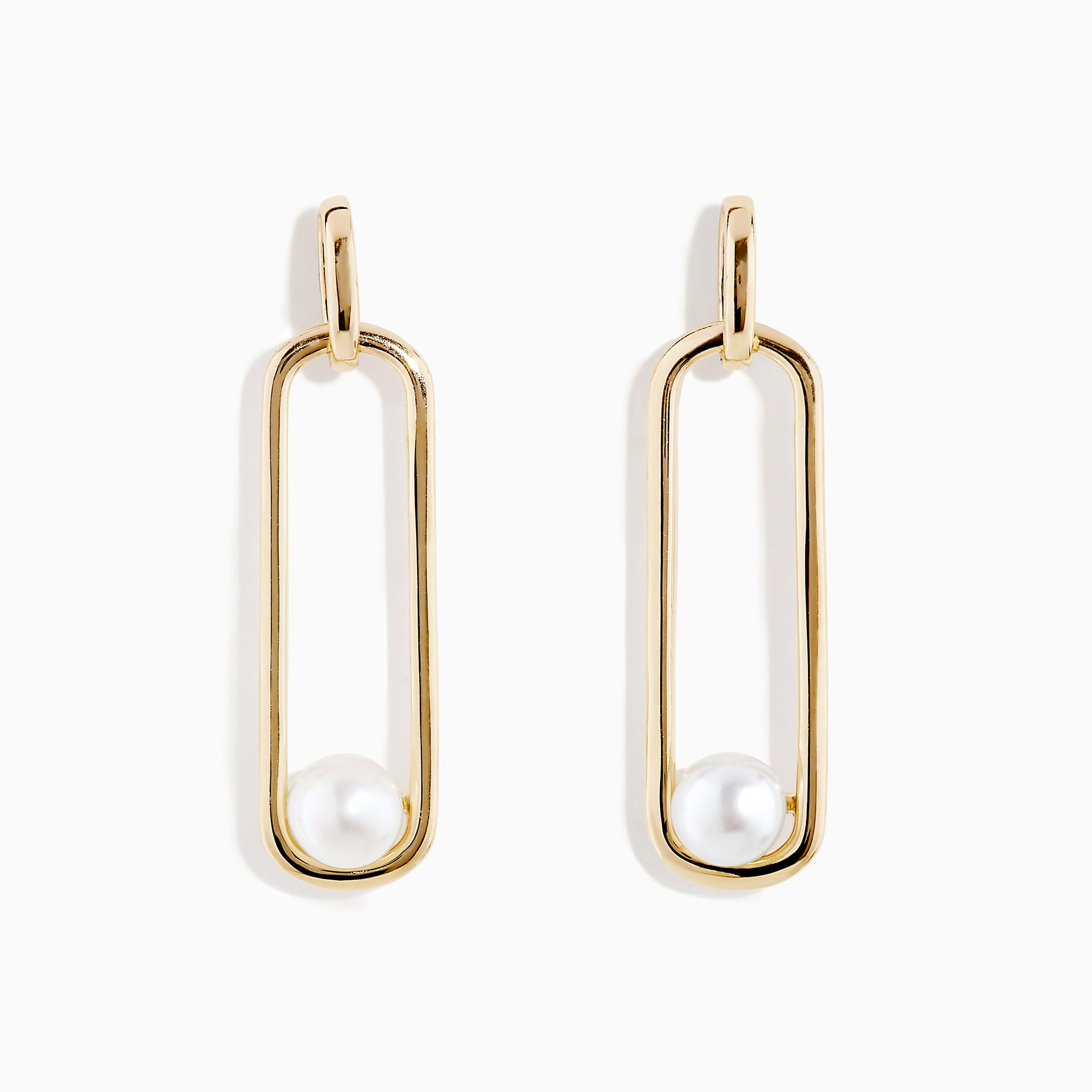 The 14K Yellow Gold Paperclip Cultured Freshwater Pearl Earrings feature elongated oval hoops in yellow gold, each adorned with a single freshwater pearl at the bottom, displayed on a plain white background.