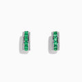 A pair of 14k White Gold Emerald and Diamond Huggie Hoop Earrings, 1.51 TCW, featuring a row of emeralds between two rows of diamonds, displayed on a plain white background.