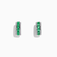 A pair of 14k White Gold Emerald and Diamond Huggie Hoop Earrings, 1.51 TCW, featuring a row of emeralds between two rows of diamonds, displayed on a plain white background.