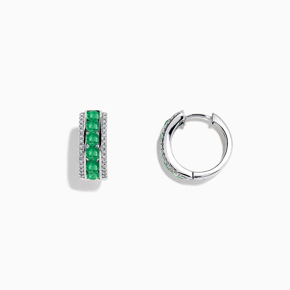 A pair of 14k White Gold Emerald and Diamond Huggie Hoop Earrings, 1.51 TCW, featuring a row of emeralds between two rows of diamonds, displayed on a plain white background.