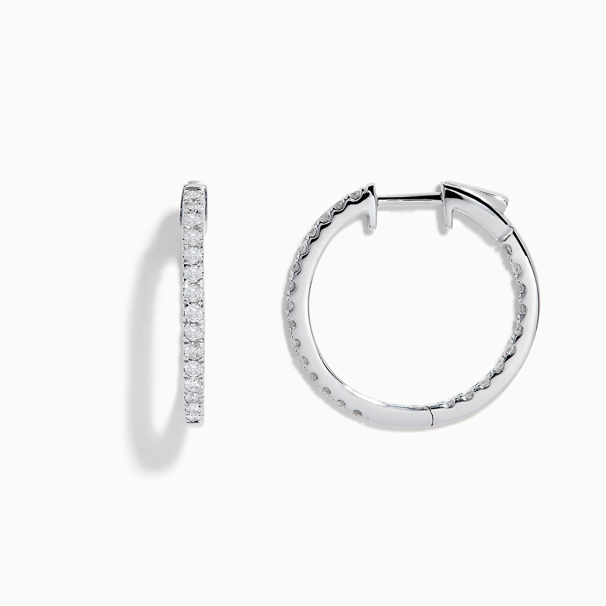 A pair of 14K White Gold 3/4 Diamond Hoop Earrings, thin and encrusted with sparkling diamonds, displayed vertically on a white background with soft shadows.