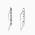 The 925 Sterling Silver Diamond Hoop Earrings, featuring small round diamonds totaling 0.24 TCW, are displayed upright on a white background to showcase the sparkling stones along the front edge.