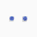 The Nahla Siri Sterling Silver Tanzanite Stud Earrings, 0.95 TCW, feature square-cut vibrant blue tanzanite gemstones set in simple prongs and are displayed against a plain white background.