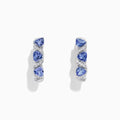 The Nahla Siri 14K Gold Tanzanite & Diamond Hoop Earrings, 2.43 TCW, feature a twisted design with pear-shaped blue stones and diamonds, elegantly photographed on a white background.