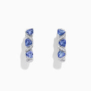 The Nahla Siri 14K Gold Tanzanite & Diamond Hoop Earrings, 2.43 TCW, feature a twisted design with pear-shaped blue stones and diamonds, elegantly photographed on a white background.