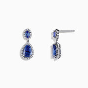 Nahla Siri 14K Gold Tanzanite and Diamond Earrings, 2.90 TCW, showcase elegant oval and teardrop blue tanzanites bordered by sparkling diamonds in a 14K gold setting on a white background.