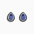 The Nahla Siri 14K Gold Tanzanite and Diamond Earrings, 1.54 TCW, feature teardrop-shaped studs with vivid blue tanzanite centers and a halo of sparkling white and black diamonds, set in luxurious gold against a white background.